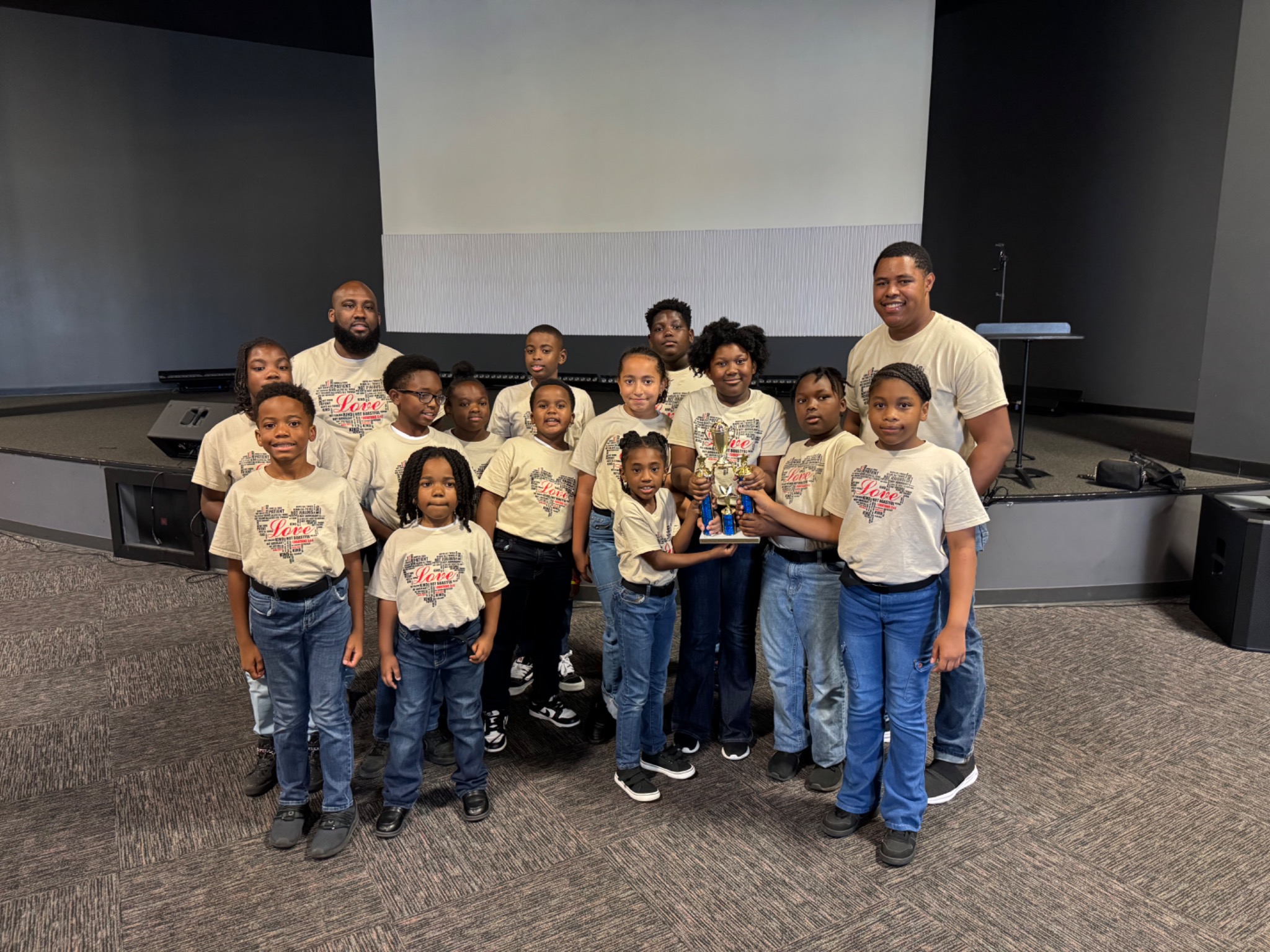 Youth drill team participants assembled in coordinated uniforms